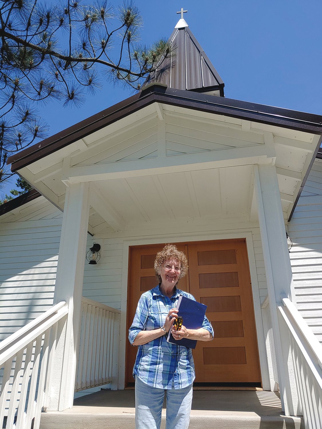 Jean Bluhm stands outside the Borst Pioneer Church in Centralia's Fort Borst Park.